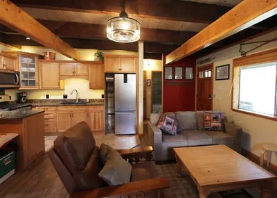 a kitchen and living room with a couch and a table at HNC0628 - Stagecoach Escape condo in Stateline