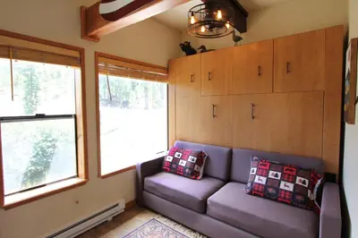 a living room with a couch and two windows at HNC0628 - Stagecoach Escape condo in Stateline