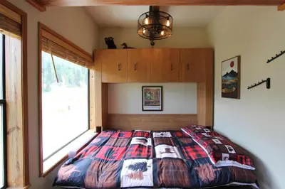 a bed in a bedroom with a large window at HNC0628 - Stagecoach Escape condo in Stateline