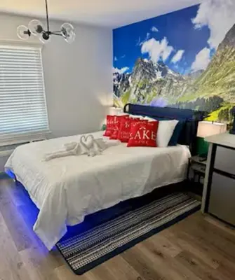 a bedroom with a bed with a painting on the wall at The Rivet in Reno