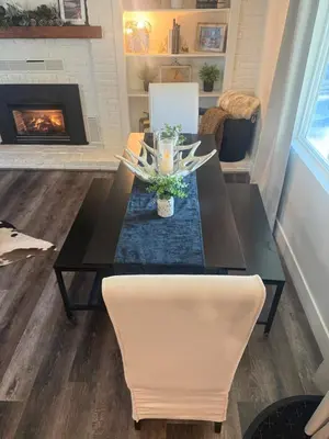 a dining room with a table and a fireplace at Emerald Bay Escape in South Lake Tahoe