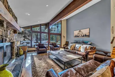 a living room with a couch and a table at The Lazy Bear Northstar Resort Truckee in Truckee