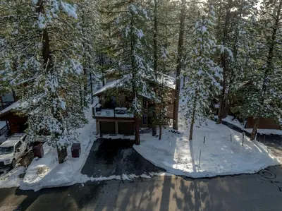 an aerial view of a house in the snow at The Lazy Bear Northstar Resort Truckee in Truckee