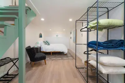 a room with bunk beds and a bedroom with a bed at Modern 1-BR Apartment Close to Downtown Vibes in Reno