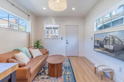 a living room with a couch and a table at Modern 1-BR Apartment Close to Downtown Vibes in Reno