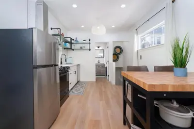 a kitchen with a stainless steel refrigerator and a counter at Modern 1-BR Apartment Close to Downtown Vibes in Reno