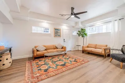 a living room with two couches and a rug at Stylish 2-Bedroom walking distance to Downtown in Reno
