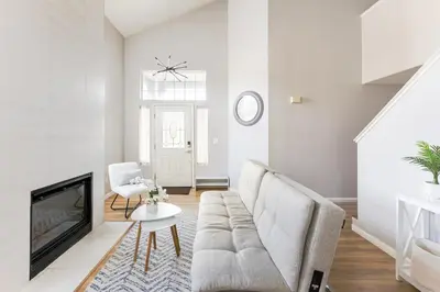 a living room with a couch and a fireplace at Designer Home conveniently located in Reno NV in Reno