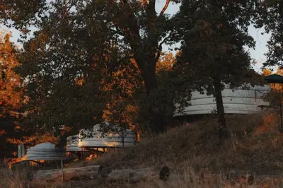 a boat sitting on a hill next to a tree at Mongolian yurt at a nature retreat in Miramonte