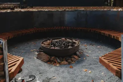 a fire pit with a pot on top of it at Cosy yurt at a nature retreat in Miramonte