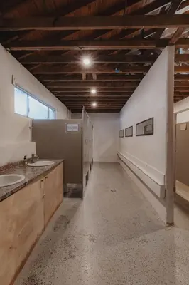 an empty bathroom with two sinks and a window at Glamping yurt at nature retreat in Sequoia NForest in Miramonte