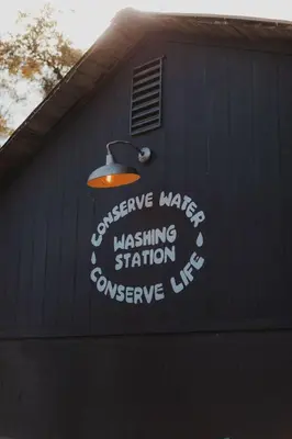 a building with a sign on the side of it at Cosy yurt at a nature retreat in CA in Miramonte