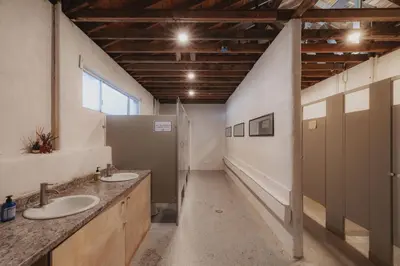 a large bathroom with two sinks and a window at Glamping yurt at Sequoia Highland Camp in Miramonte