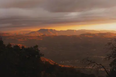 a view of a mountain range at sunset at Glamping yurt at a nature retreat Sequoia Highland in Miramonte