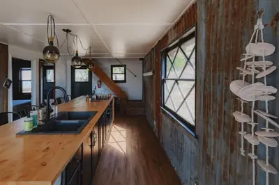 a kitchen with a sink and a counter top at Secluded rustic 3-bedroom cabin on private land in Miramonte