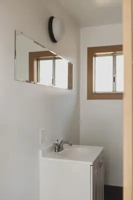 a bathroom with a sink and a mirror at Secluded rustic 2-bedroom cabin at nature retreat in Miramonte