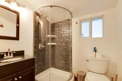 a bathroom with a shower and a toilet and a sink at Hike, Ski and Sip Arnold Cabin 4 Mi to State Park! in Arnold