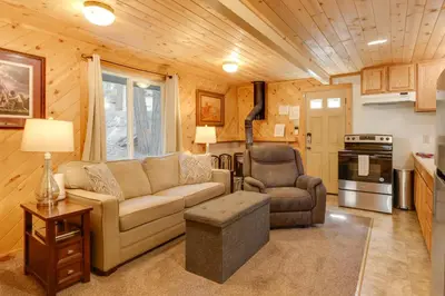 a living room with a couch and a chair at Hike, Ski and Sip Arnold Cabin 4 Mi to State Park! in Arnold