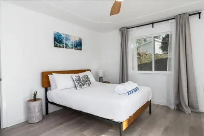 a bedroom with a bed and a window at New Yosemite Dream Nest with HUGE views/spa/firepit/pet friendly in Oakhurst