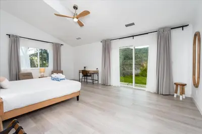 a bedroom with a bed and a ceiling fan at New Yosemite Dream Nest with HUGE views/spa/firepit/pet friendly in Oakhurst