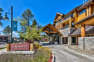 a building with a sign in front of a street at Pinnacle Stateline Resort BBQ Hot Tub Pool Zalanta 214 in Stateline