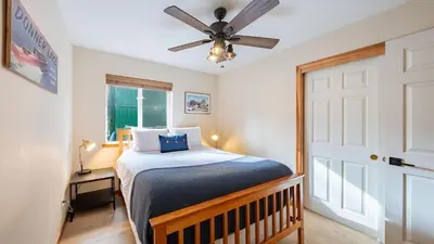 a bedroom with a bed and a ceiling fan at Stylish Truckee Retreat Deck Near Lake Skiing Moraine by AvantStay in Truckee
