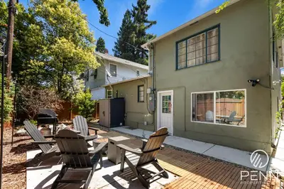 a patio with chairs and a table in front of a house at Midtown Gem with Secret Speakeasy in Sacramento