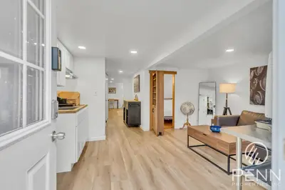 a kitchen and living room with a couch and a table at Midtown Gem with Secret Speakeasy in Sacramento