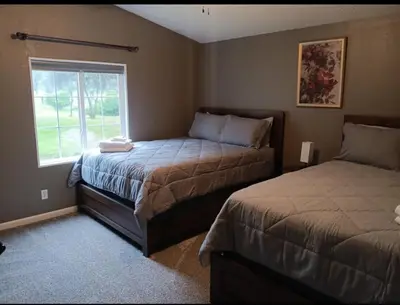 a bedroom with two beds and a window at Sequoia Eagle Nest in Three Rivers