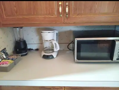 a kitchen counter with a coffee maker and a microwave at Sequoia Eagle Nest in Three Rivers