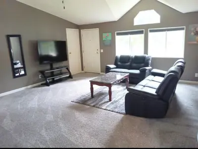a living room with a couch and a tv at Sequoia Eagle Nest in Three Rivers