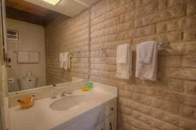 a bathroom with a sink and a mirror and towels at TKC0604 - Betty Ann's Place condo in South Lake Tahoe