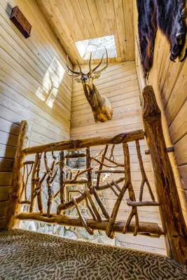 a room with a bed with a deer head on the wall at HCH1239 - Heavenly Tree House home in South Lake Tahoe