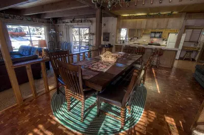 a dining room table and chairs in a kitchen at TKH1226 - Emerald Lodge home in South Lake Tahoe