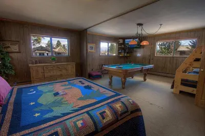 a bedroom with a bed and a pool table at TKH1226 - Emerald Lodge home in South Lake Tahoe