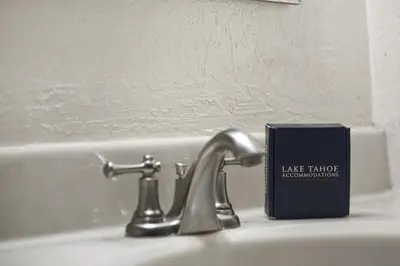 a bathroom sink with a book next to a faucet at COH0885 - Skyline Divine home in South Lake Tahoe