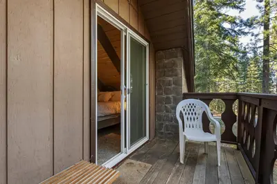 a white chair sitting on the porch of a house at COH0885 - Skyline Divine home in South Lake Tahoe