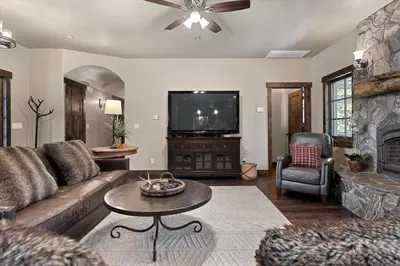 a living room with a couch and a tv at CYH1012 - Hidden Cedar home in South Lake Tahoe