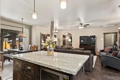 a kitchen and living room with a large island at CYH1012 - Hidden Cedar home in South Lake Tahoe
