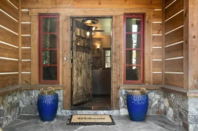 two blue vases sitting in front of a door at CYH1012 - Hidden Cedar home in South Lake Tahoe