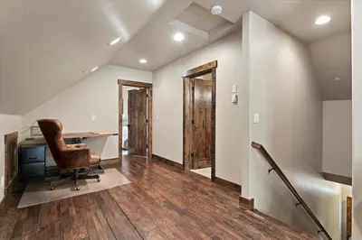 an attic office with a desk and a chair at CYH1012 - Hidden Cedar home in South Lake Tahoe
