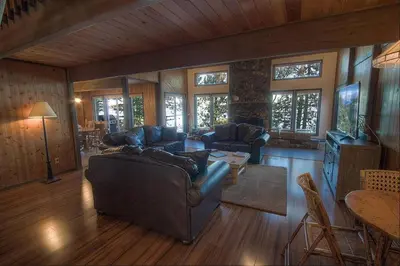 a living room with a couch and a table at CYH1281- Tahoe Acres home in South Lake Tahoe
