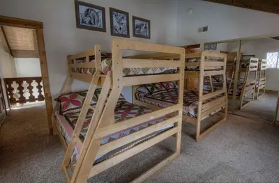 a group of bunk beds in a room at HCH1217 - Pinehill Ponderosa home in South Lake Tahoe