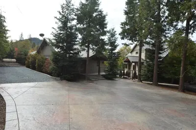 an empty driveway in front of a house at Deer Lodge #1 Lake front in Bass Lake