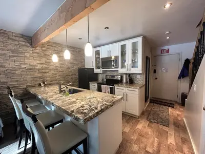 a kitchen with white cabinets and a counter top at HCC0410 - Heavenly Hideaway condo in South Lake Tahoe