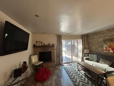 a living room with a couch and a television at HCC0410 - Heavenly Hideaway condo in South Lake Tahoe