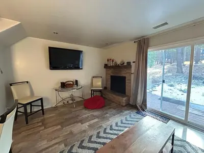 a living room with a fireplace and a flat screen tv at HCC0410 - Heavenly Hideaway condo in South Lake Tahoe