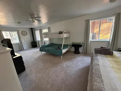 a bedroom with a bed and a ceiling fan at COH0957 - Bella Ari home in South Lake Tahoe