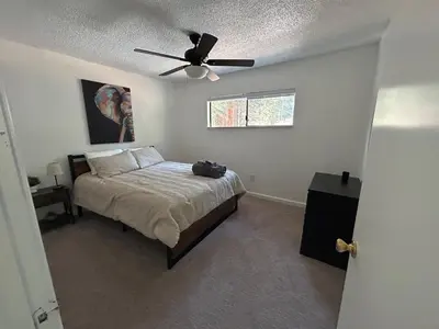 a bedroom with a bed with a ceiling fan at COH0957 - Bella Ari home in South Lake Tahoe