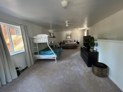 a bedroom with a bunk bed and a couch at COH0957 - Bella Ari home in South Lake Tahoe